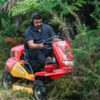 Canycom CMX2402 Ride-on Brushcutter clearing dense vegetation.