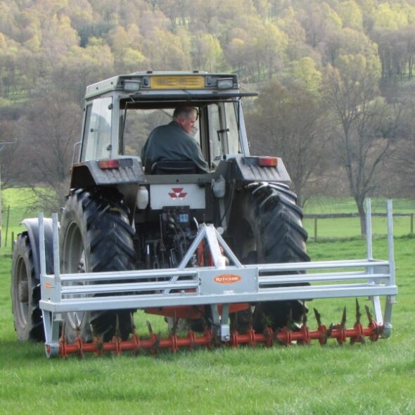 Ritchie 3m Aerator attached to tractor and in use