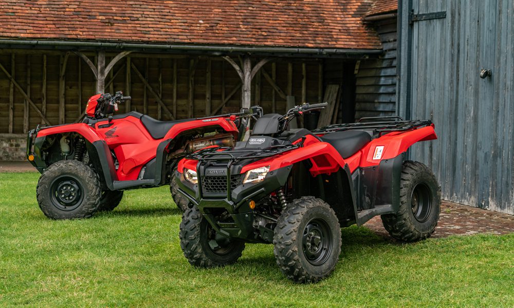 Two red Honda quad bikes