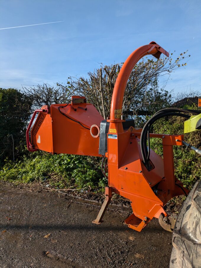 Tractor-mounted wood chipper by Timberwolf