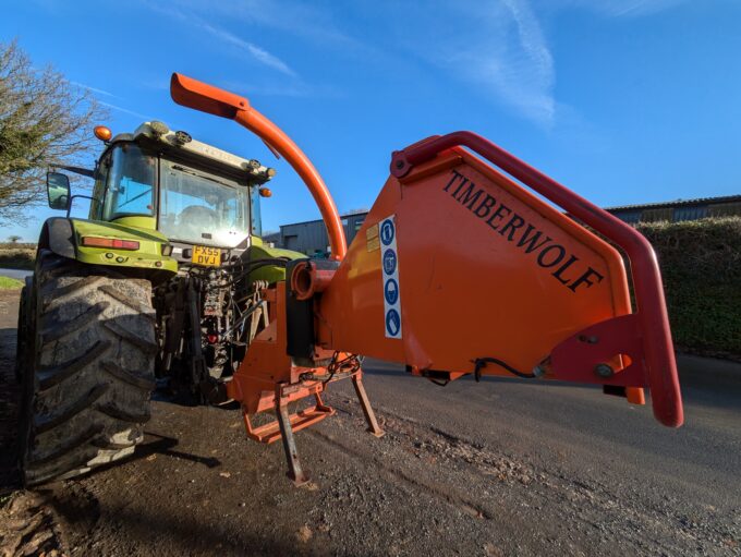 Tractor-mounted wood chipper by Timberwolf