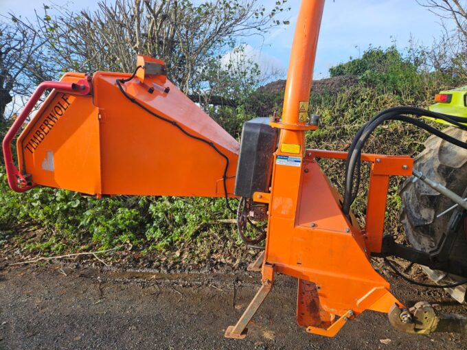 Tractor-mounted wood chipper by Timberwolf