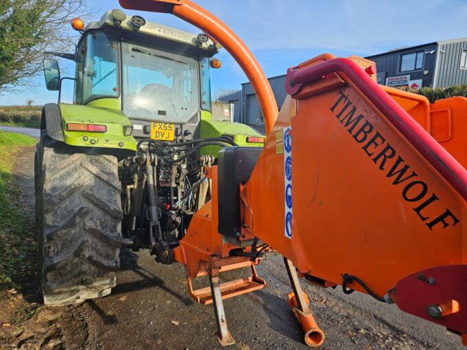 Tractor-mounted wood chipper by Timberwolf