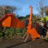 Tractor-mounted wood chipper by Timberwolf
