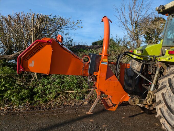 Tractor-mounted wood chipper by Timberwolf