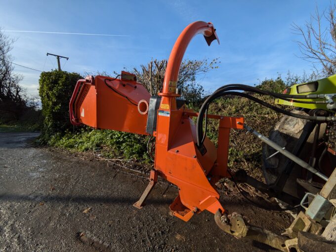 Tractor-mounted wood chipper by Timberwolf