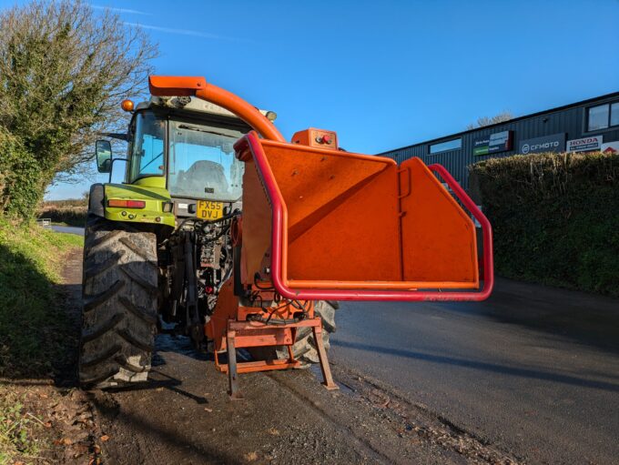 Tractor-mounted wood chipper by Timberwolf