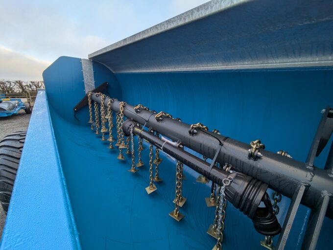 Close up of chains and flails on Fleming MS1000 side discharge muck spreader