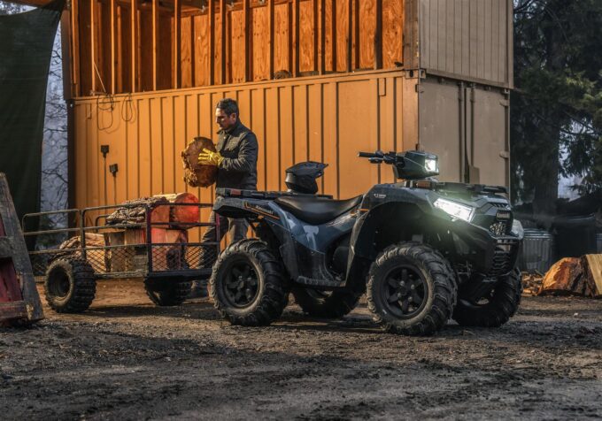 Kawasaki Brute Force 750 quad bike with trailer filled with logs