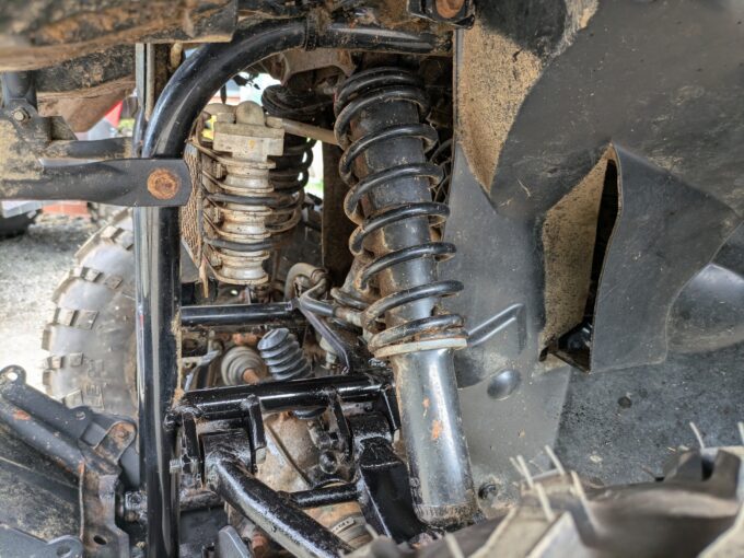 Shock absorber spring on Suzuki KingQuad 400 FSi quad bike