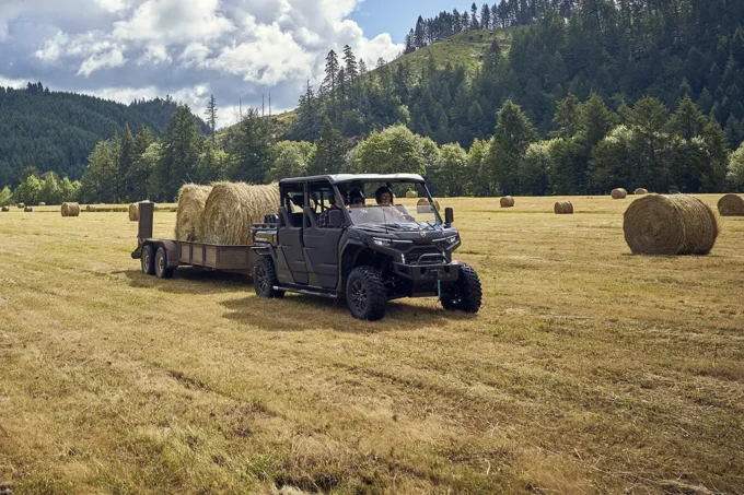 CFMOTO U10 PRO XL utility vehicle collecting large round bales in a field