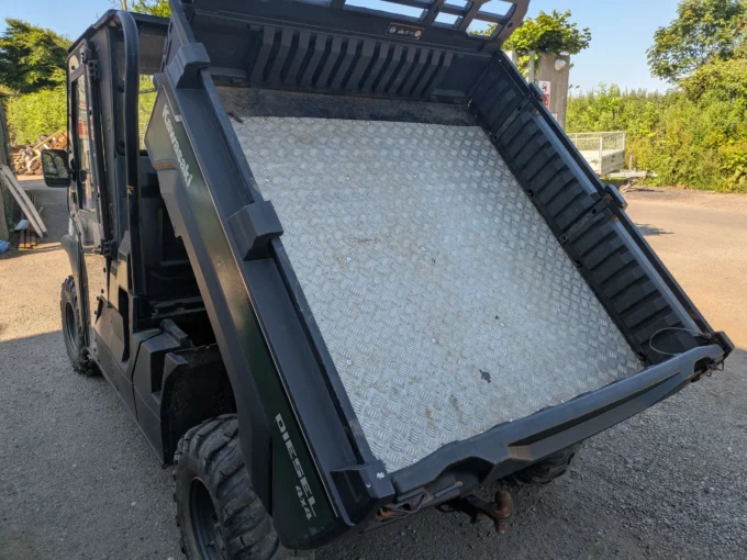 Kawasaki Mule Pro-DX with cargo bed tipped